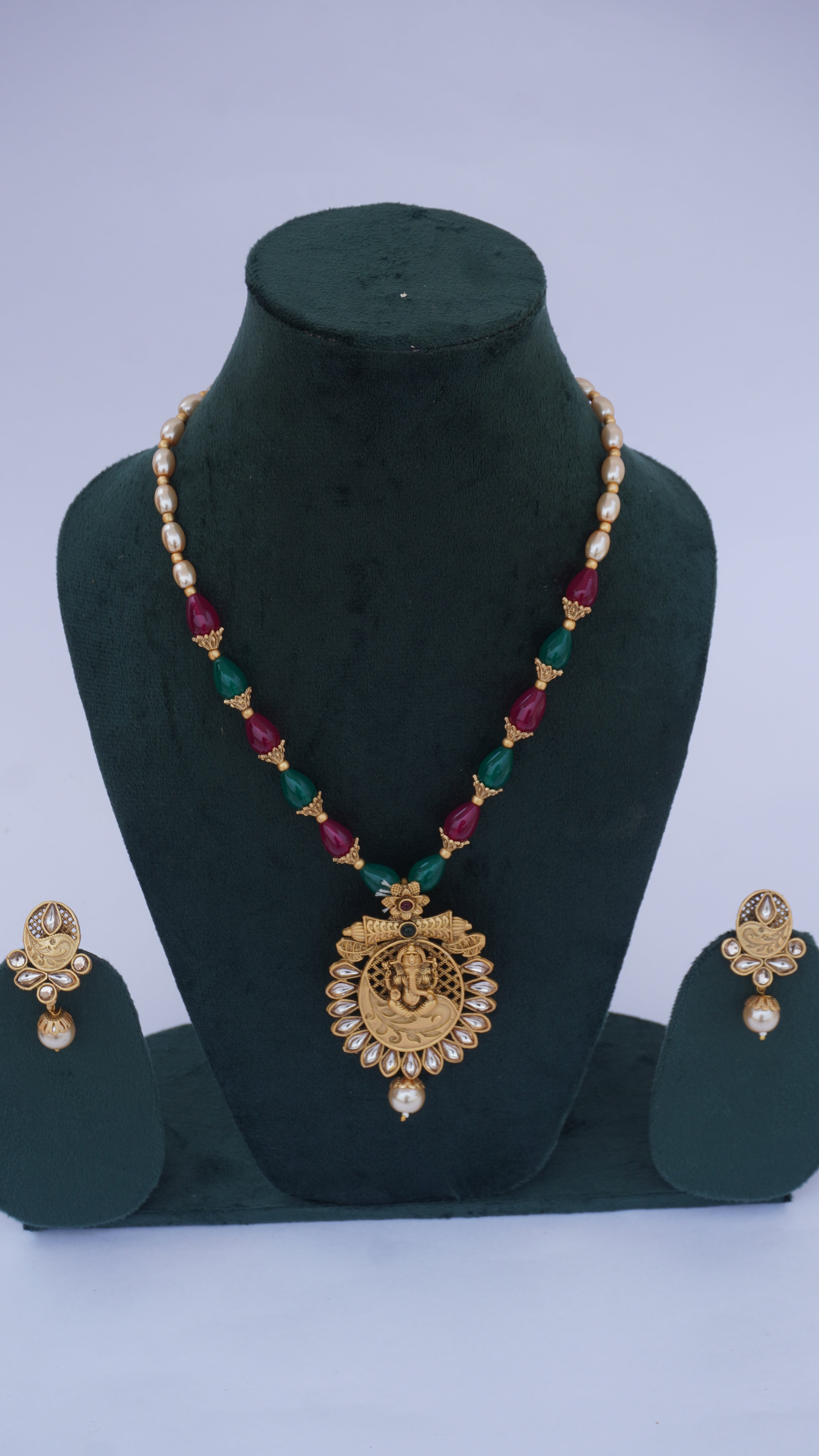 Traditional Ganesha Temple Necklace Set with Kundan Work and Pearl Drops – Red & Green Beads – Ashthi Jewels
