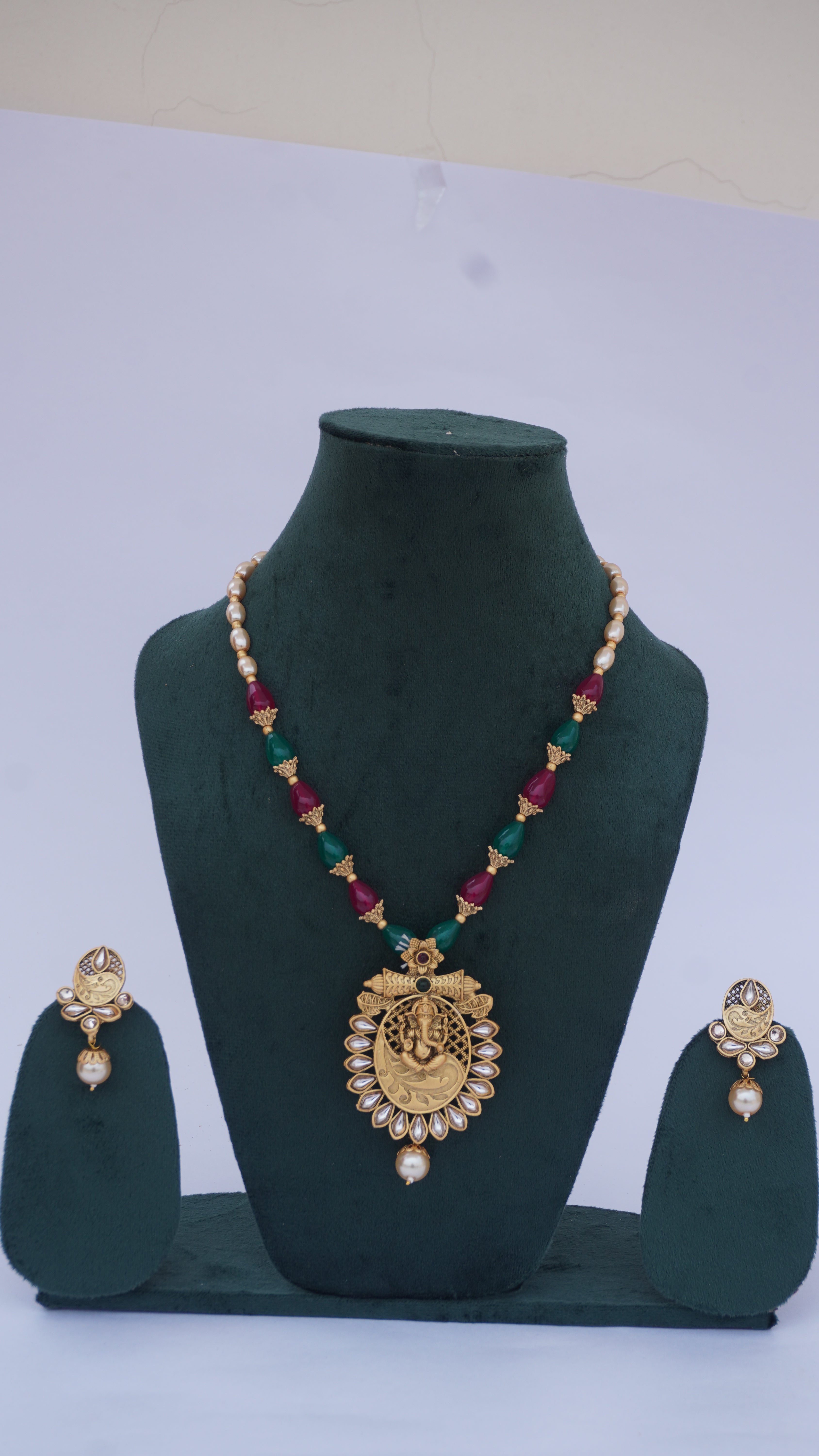 Traditional Ganesha Temple Necklace Set with Kundan Work and Pearl Drops – Red & Green Beads – Ashthi Jewels
