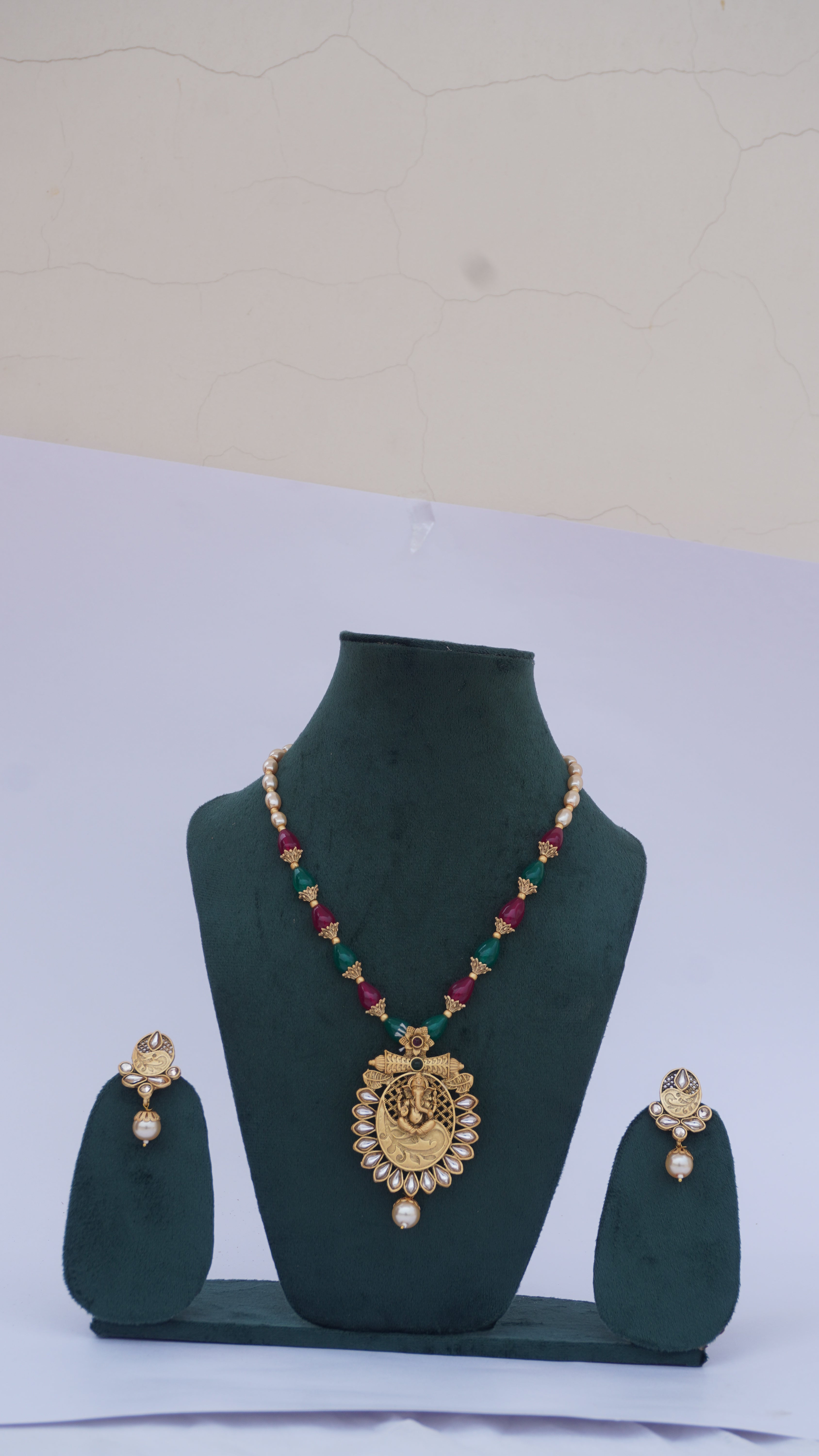 Traditional Ganesha Temple Necklace Set with Kundan Work and Pearl Drops – Red & Green Beads – Ashthi Jewels
