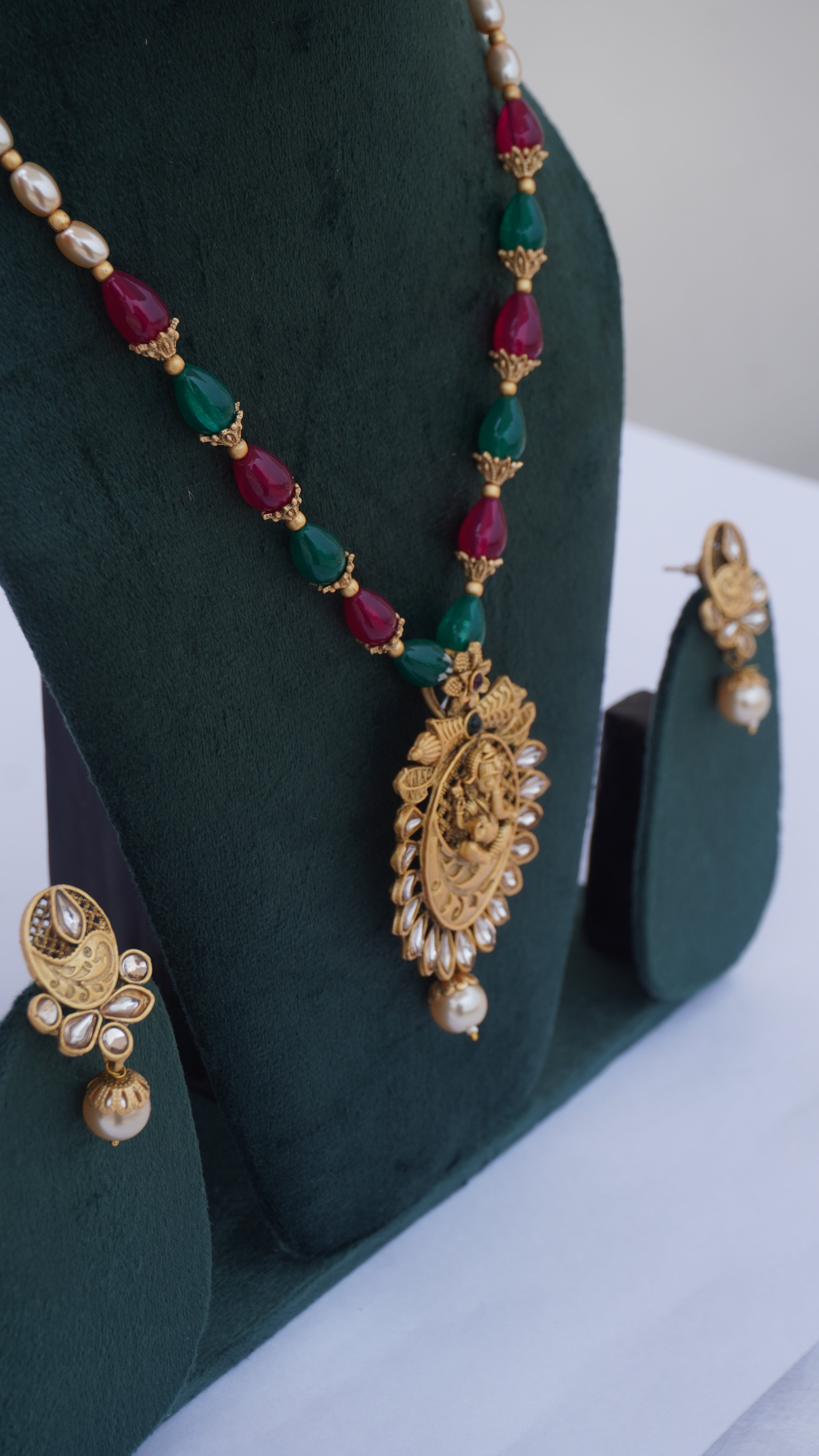 Traditional Ganesha Temple Necklace Set with Kundan Work and Pearl Drops – Red & Green Beads – Ashthi Jewels