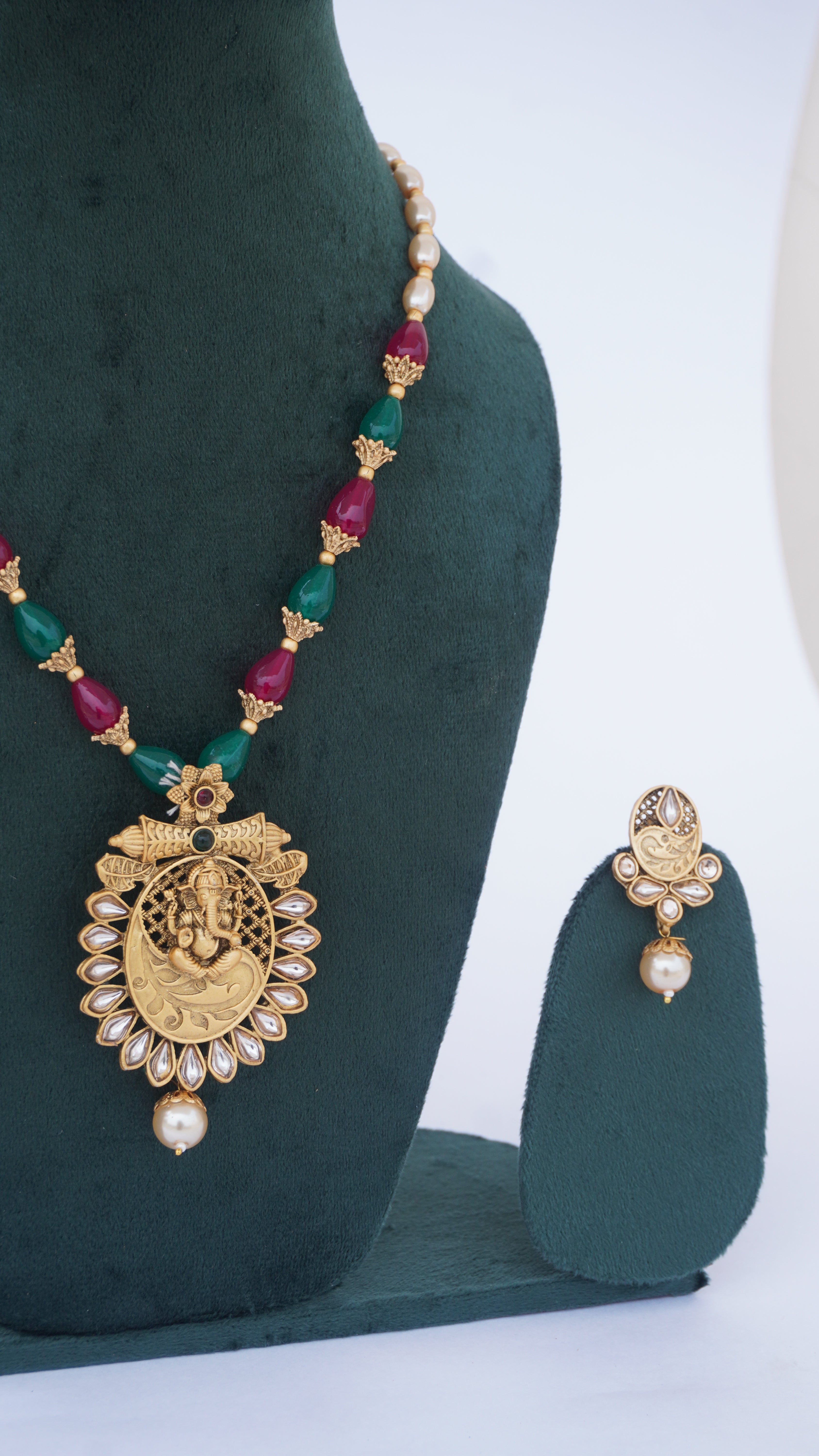 Traditional Ganesha Temple Necklace Set with Kundan Work and Pearl Drops – Red & Green Beads – Ashthi Jewels